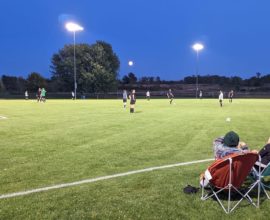 Soccer being played under the lights
