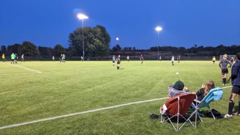 Soccer being played under the lights