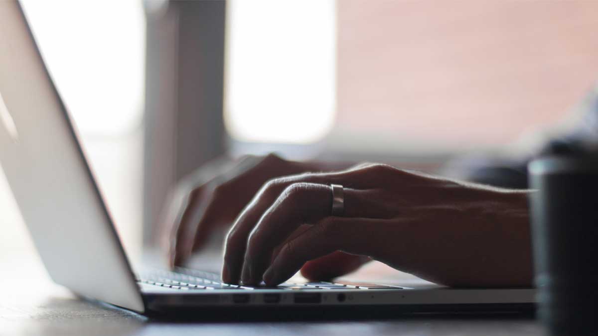 Person typing on computer