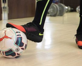 Futsal player with futsal ball