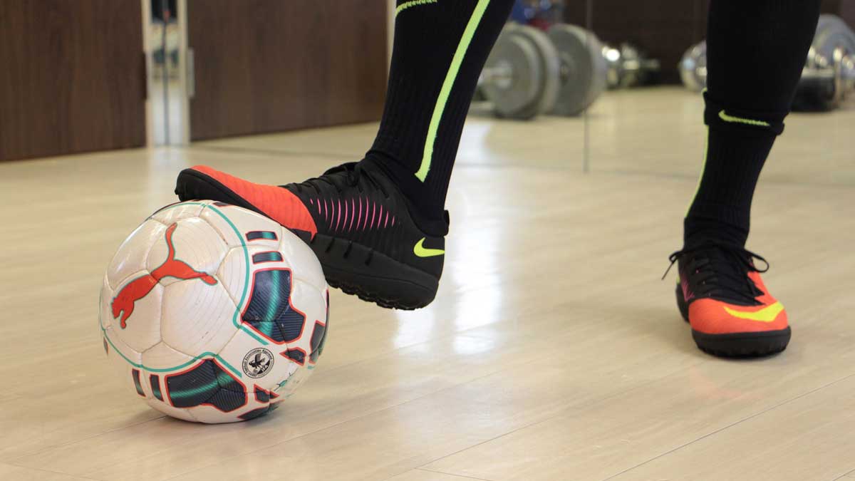 Futsal player with futsal ball