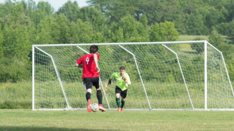 player approaches the net with the ball