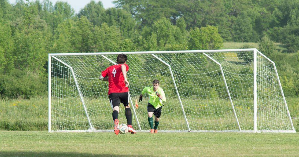 player approaches the net with the ball